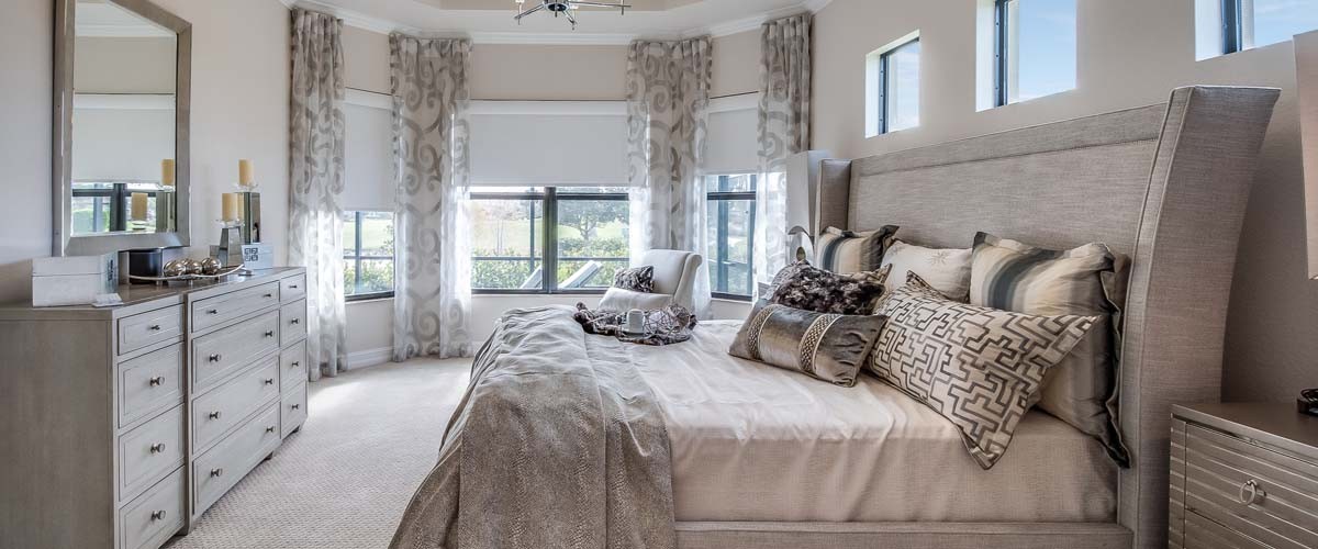 Many luxuries such as chandelier, coffered ceiling and reading nook in master bedroom